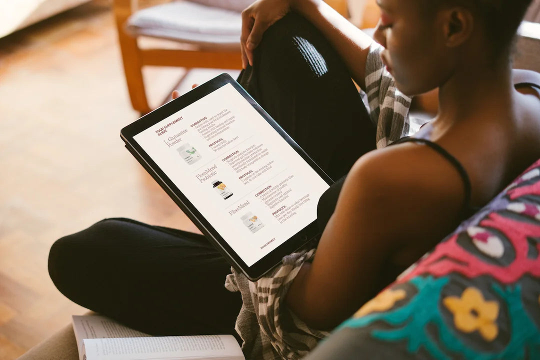 Woman reading supplement protocol on an Ipad 